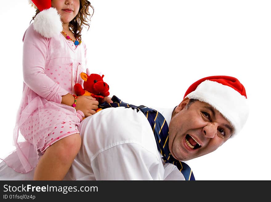 Girl holding her toy riding on father's back isolated with white background. Girl holding her toy riding on father's back isolated with white background