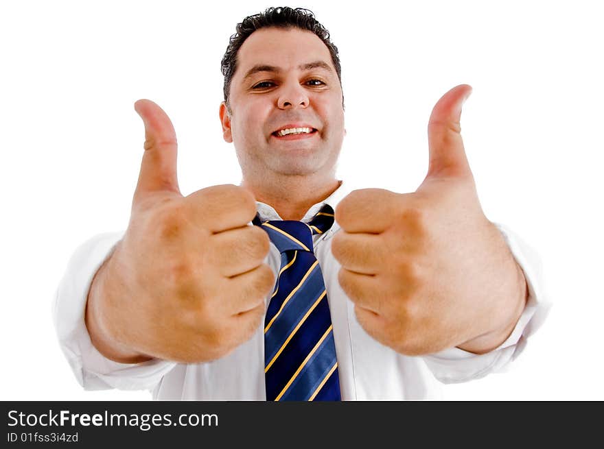 Smiling executive with goodluck hand gesture isolated with white background