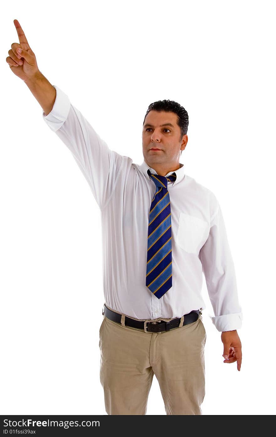 Serious businessman pointing sideway against white background