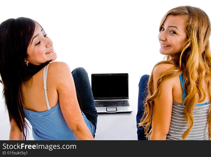 Back pose of school girls with notebook on an isolated background. Back pose of school girls with notebook on an isolated background