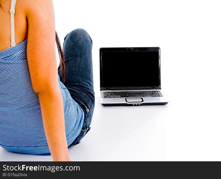 Back pose of female student and laptop against a white background