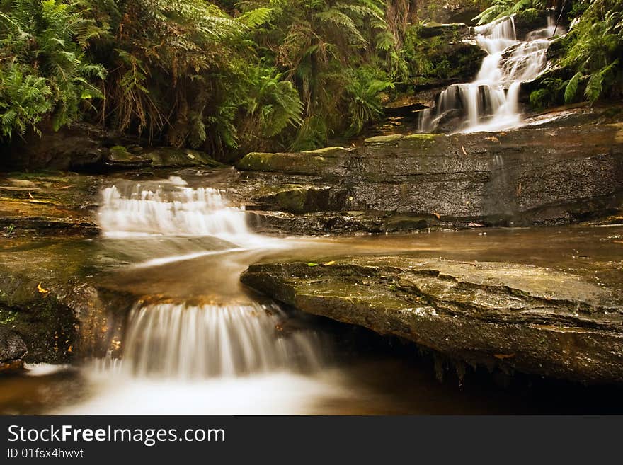 Misty waterfall in Blue mountains National park in NSW, Australia. Misty waterfall in Blue mountains National park in NSW, Australia.