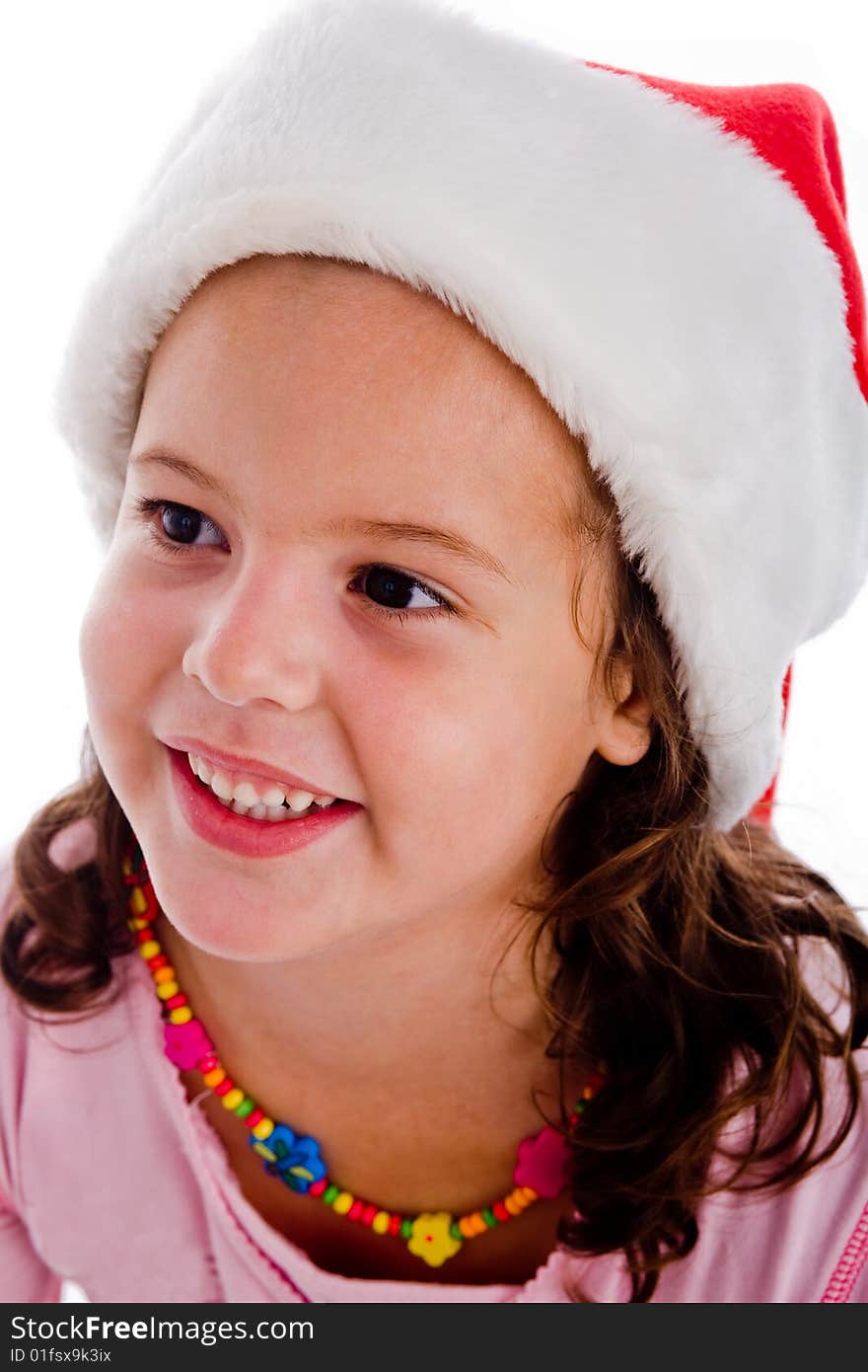 Portrait of child with christmas hat against an isolated background