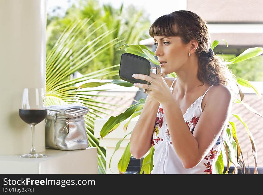 Portrait of young attractive woman having good time in tropic environment. Portrait of young attractive woman having good time in tropic environment