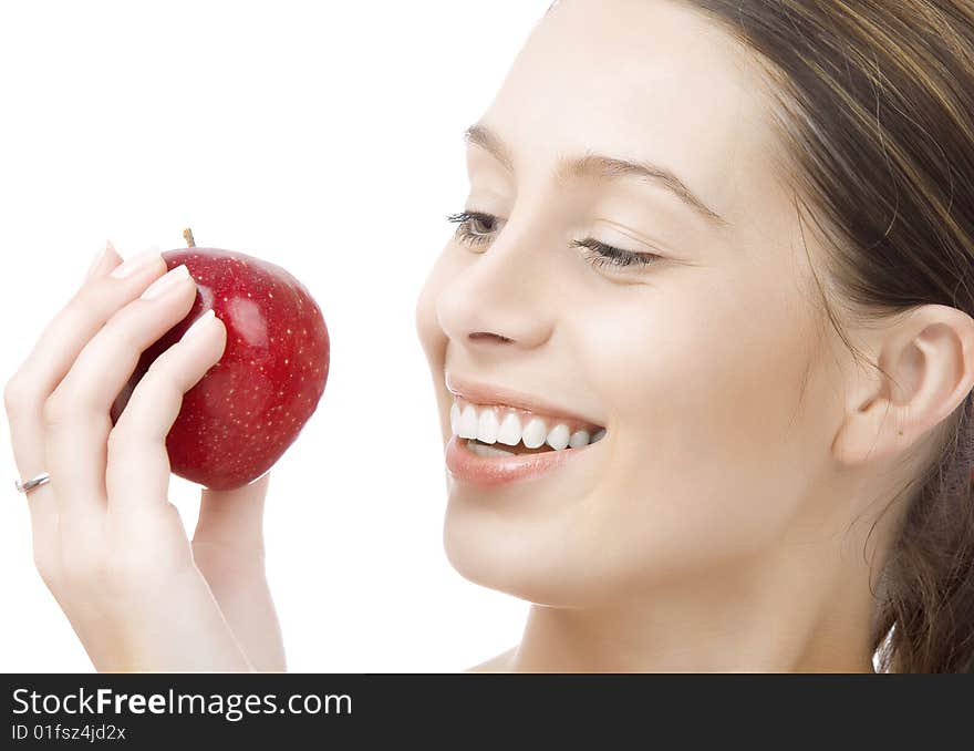 Portrait of young woman with red apple  on white back