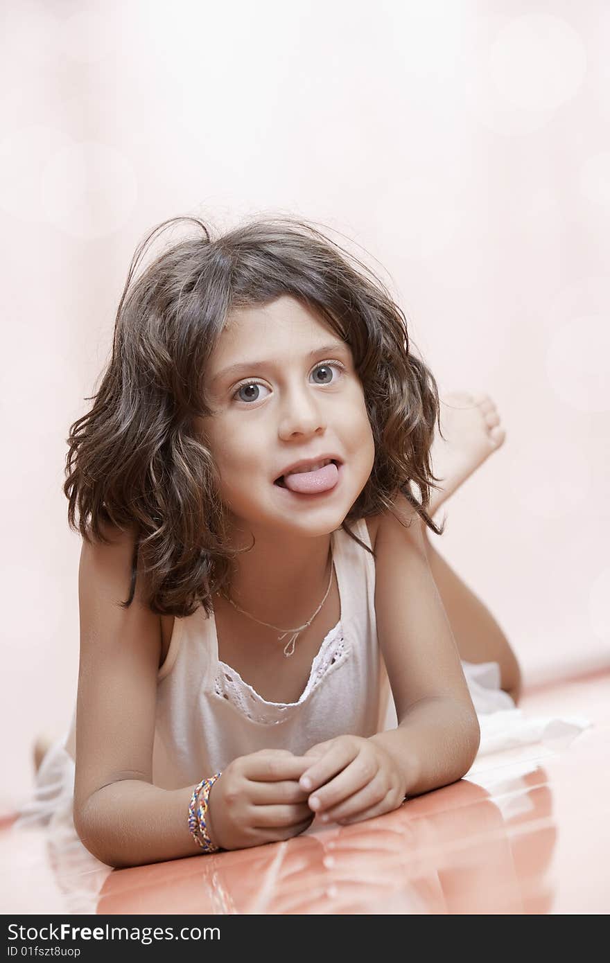 Studio portrait of  nice little girl having good time