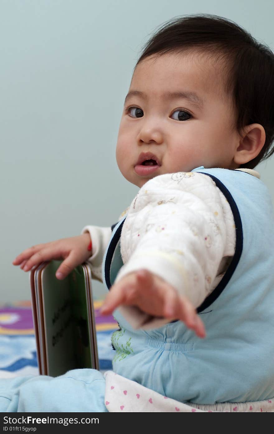 Small baby needs help when she is reading. Small baby needs help when she is reading