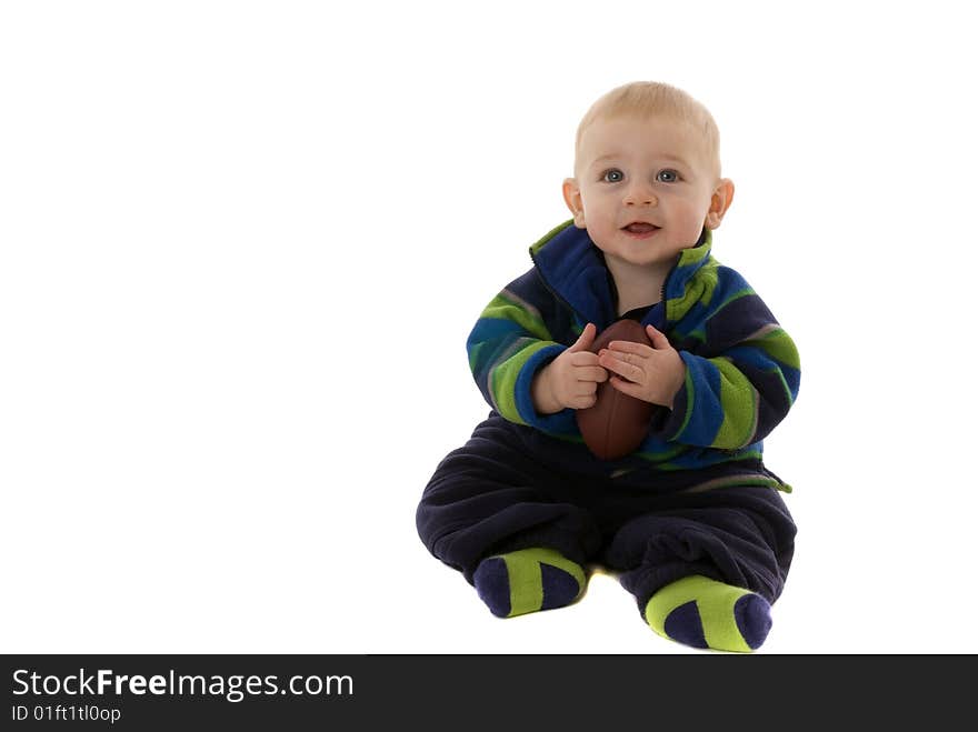 Happy Baby Boy Holds Football While Smiling