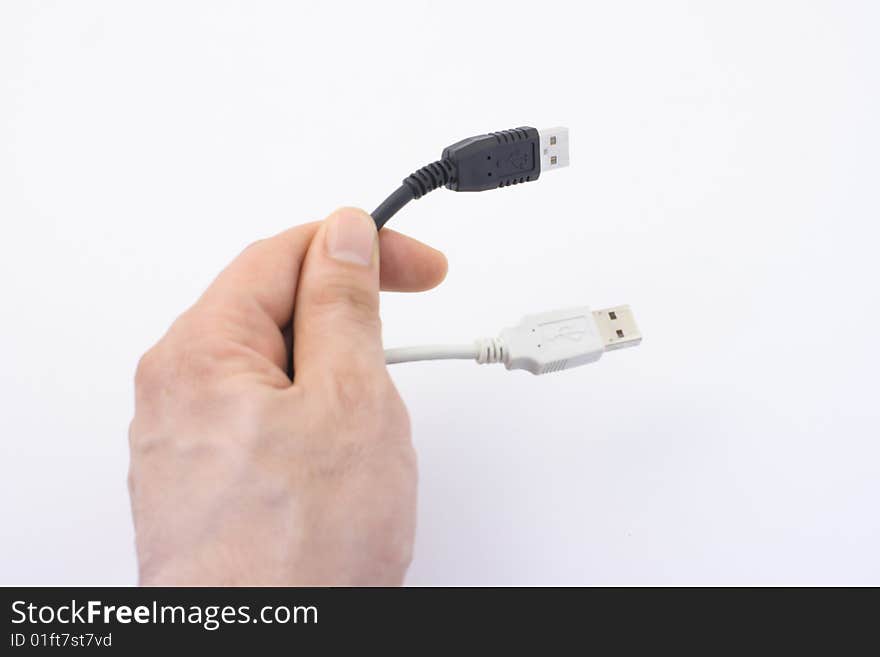 Hand with black and white cable. Hand with black and white cable