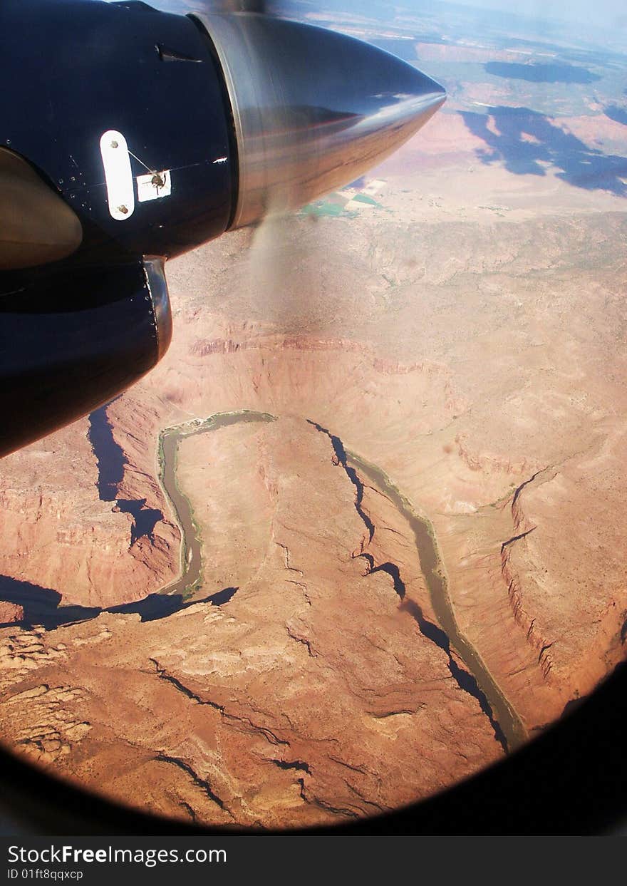 Prop motor and Utah Canyonlands aerial view out window. Prop motor and Utah Canyonlands aerial view out window