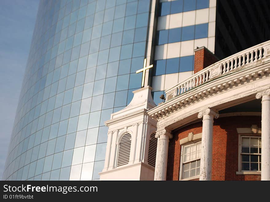 View of a historic church in Manhattan and skyscrapers in the financial district near Wall Street. View of a historic church in Manhattan and skyscrapers in the financial district near Wall Street