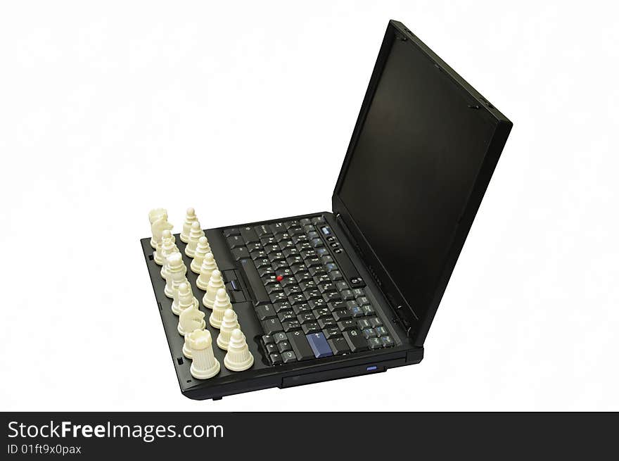 Chess on the keyboard of computer.Computer on a white background.