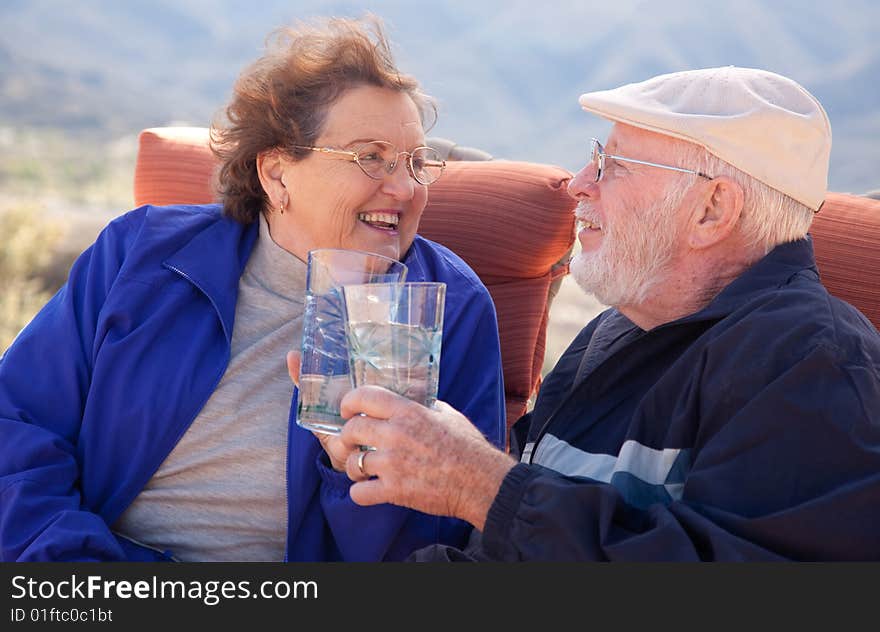 Happy Senior Adult Couple with Drinks