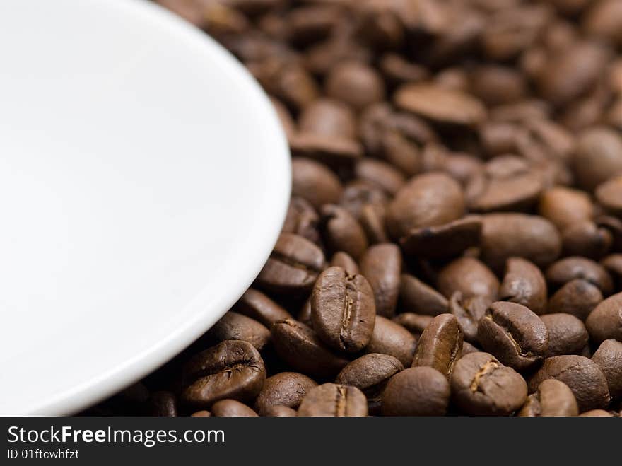 Saucer and coffee beans background