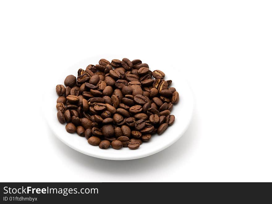 Saucer of coffee beans background