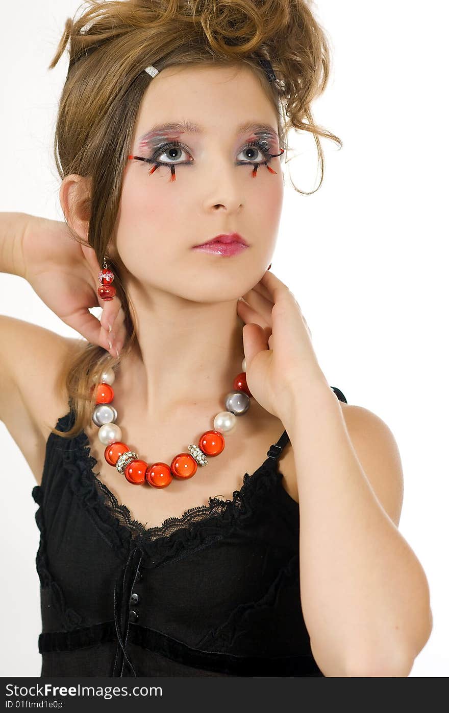 Young fashion girl with special eye makeup, jewelry and black top. Young fashion girl with special eye makeup, jewelry and black top