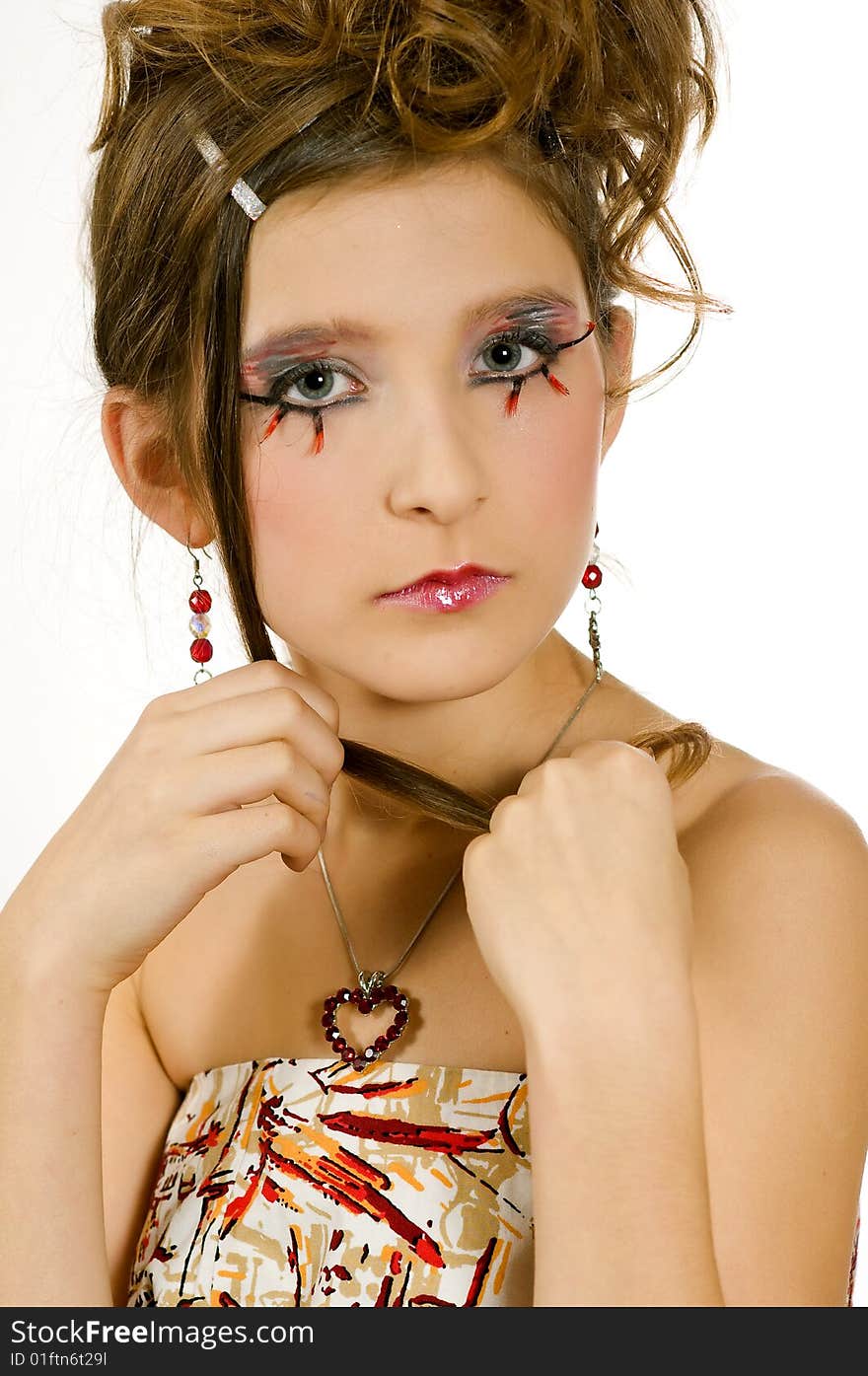 Face closeup of young girl with special eye makeup and hair done. Face closeup of young girl with special eye makeup and hair done