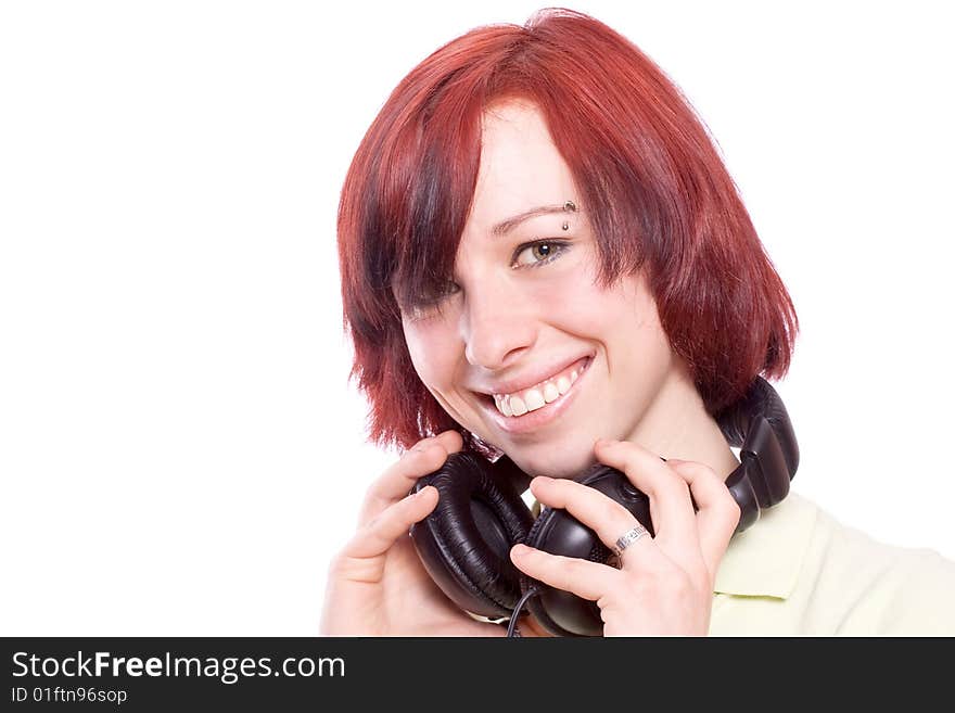 Isolated smiling young girl listening to music. Isolated smiling young girl listening to music