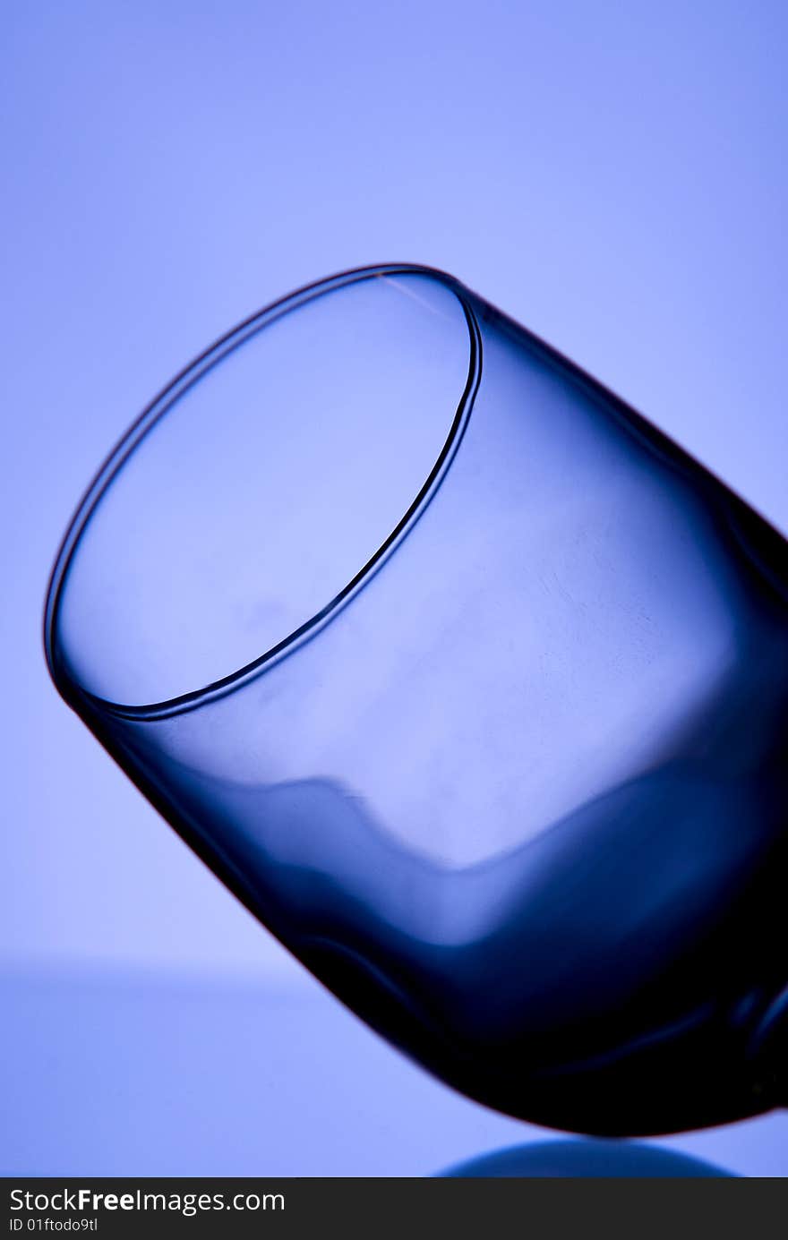 Glass on blue background photographed in studio