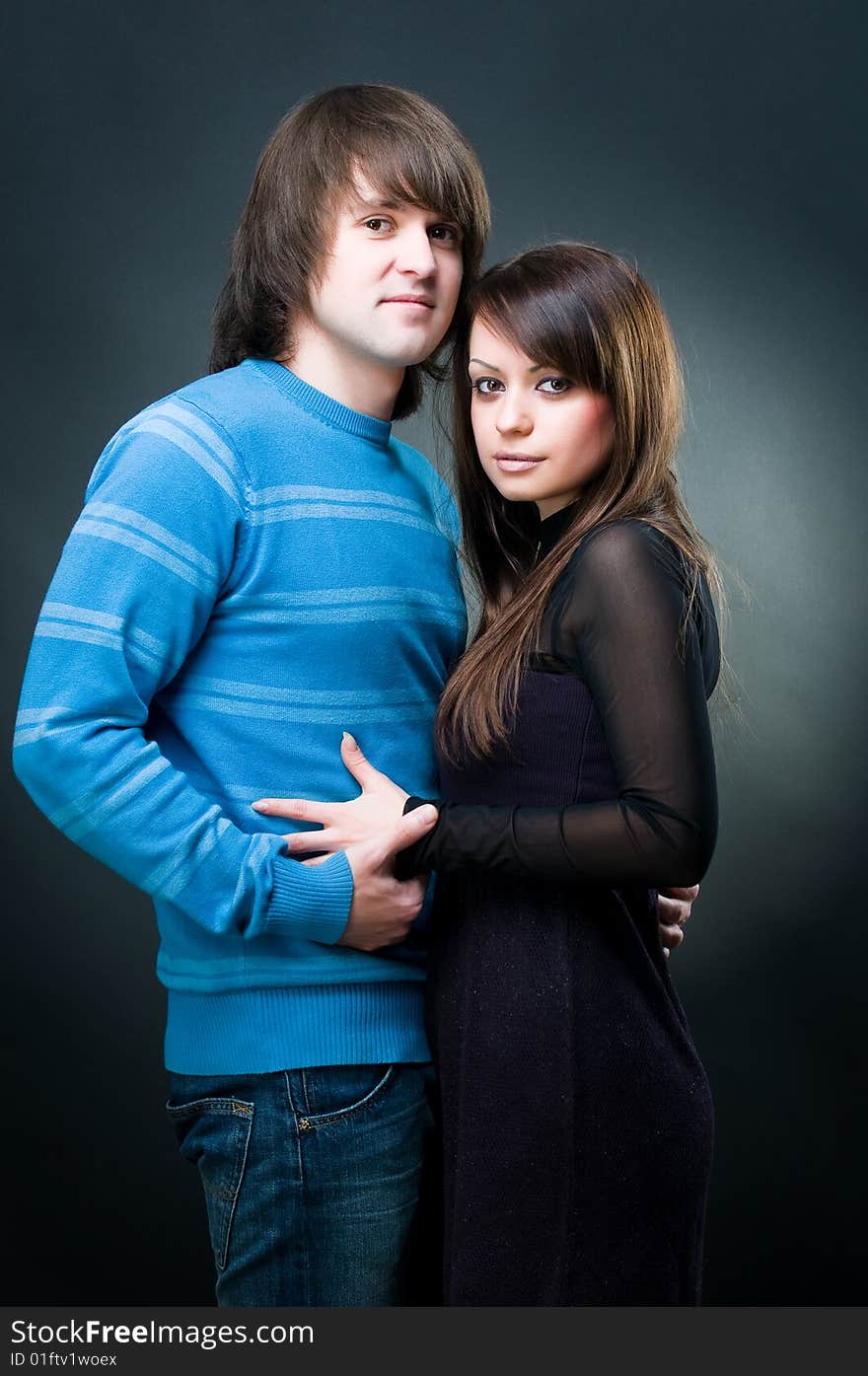 Young lovely couple, studio shot