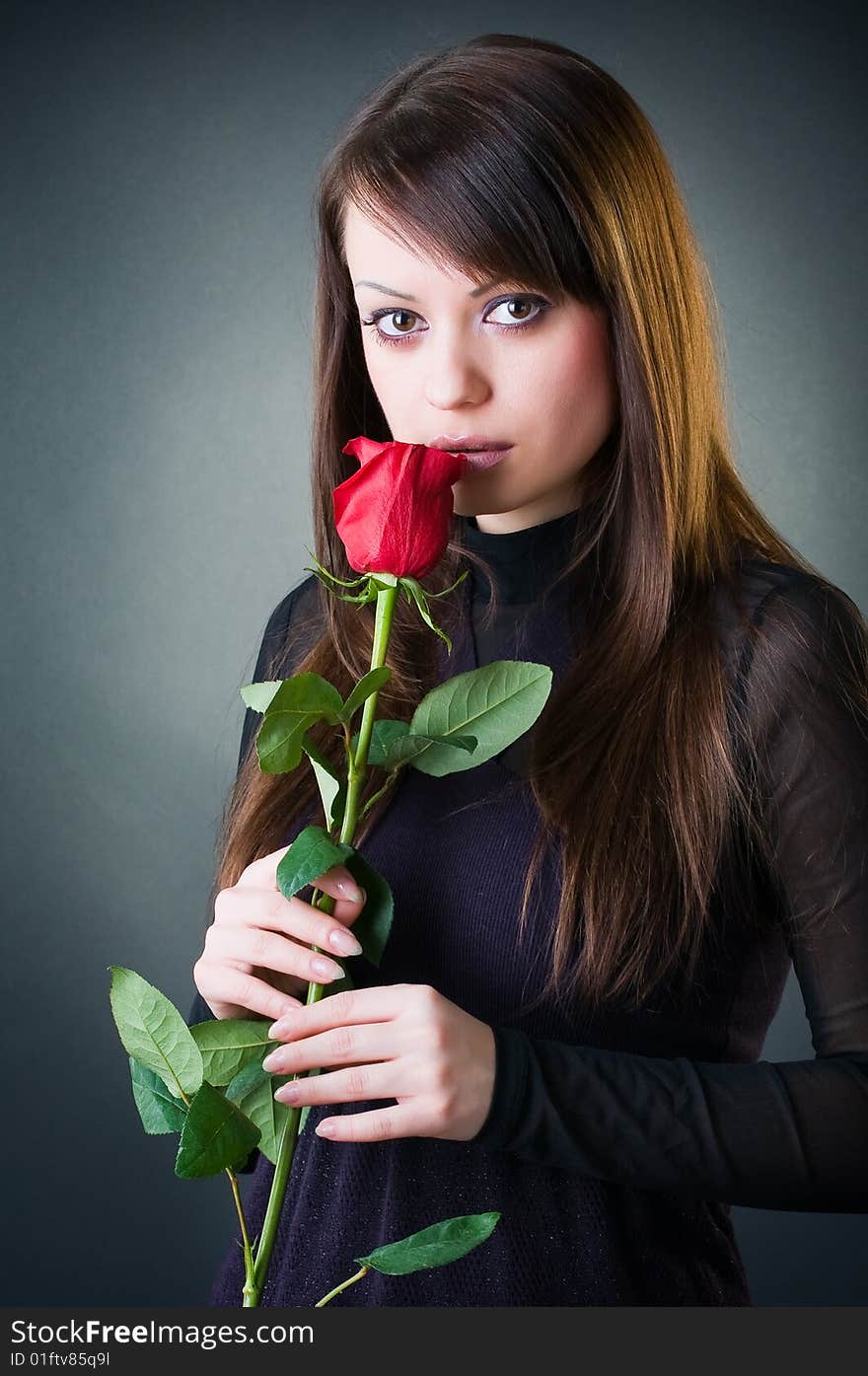 Sensual girl with rose, studio shot