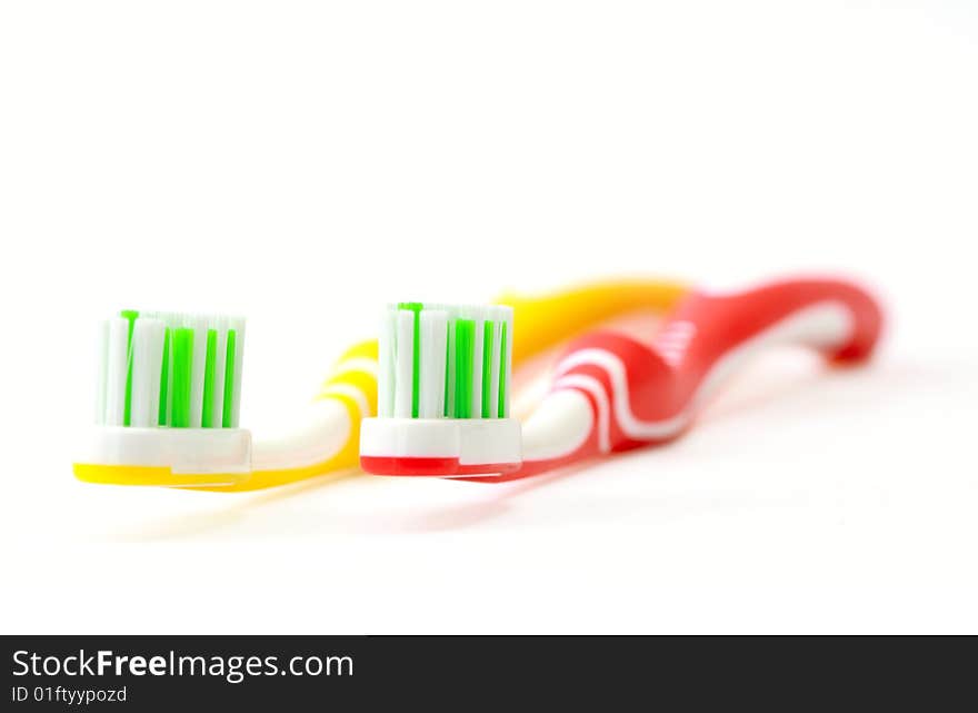 Two toothbrushes on white background