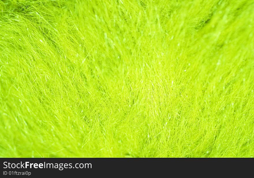 Blurred bright green grass (as an abstract summer background)