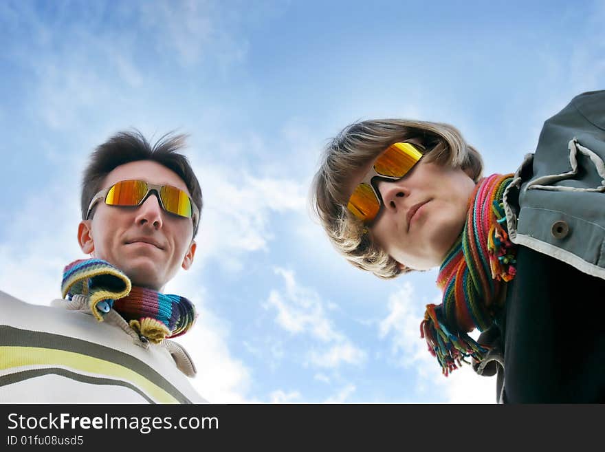 Young couple looking down into camera