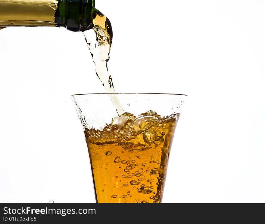 Pouring champagne isolated on white