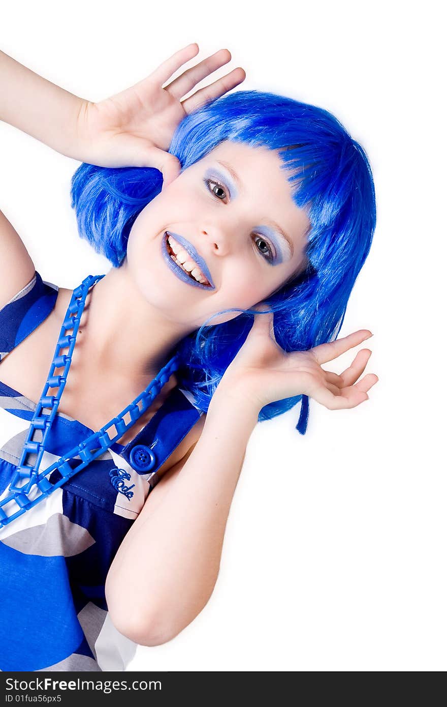 Young enthusiastic child with a blue wig shot on a white background. Young enthusiastic child with a blue wig shot on a white background