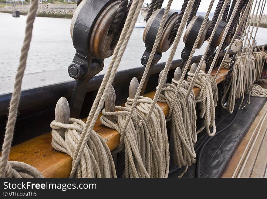 Old rigging along a side of an old tall ship. Old rigging along a side of an old tall ship