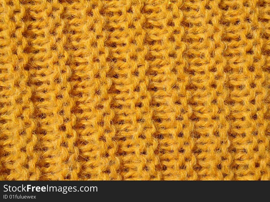 A yellow knitted wool texture