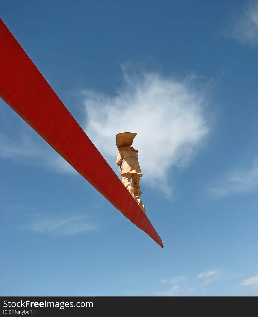 A statue of a man on standing on the edge