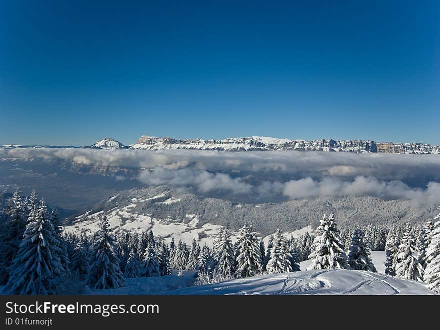 the white summits on the belledonne mountain in french alps. the white summits on the belledonne mountain in french alps