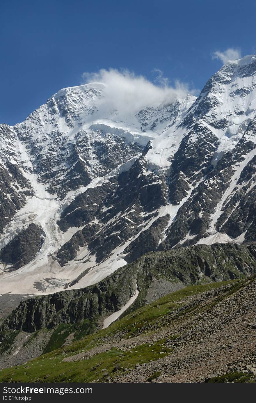 Winter scene of the tall mountain covered by snow. Winter scene of the tall mountain covered by snow