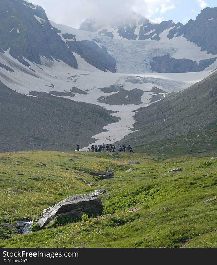 Group of tourists in highland of the Caucasus