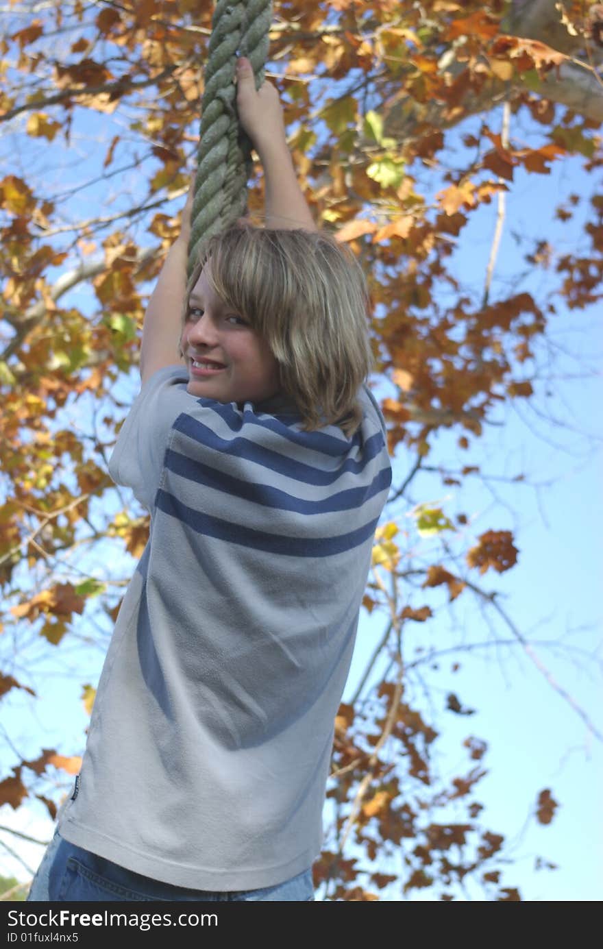 Boy on tire swing 2