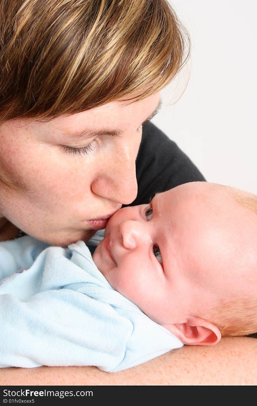 Loving mother holding her new baby boy. Loving mother holding her new baby boy