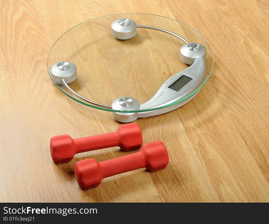 Weight scale with dumbbels