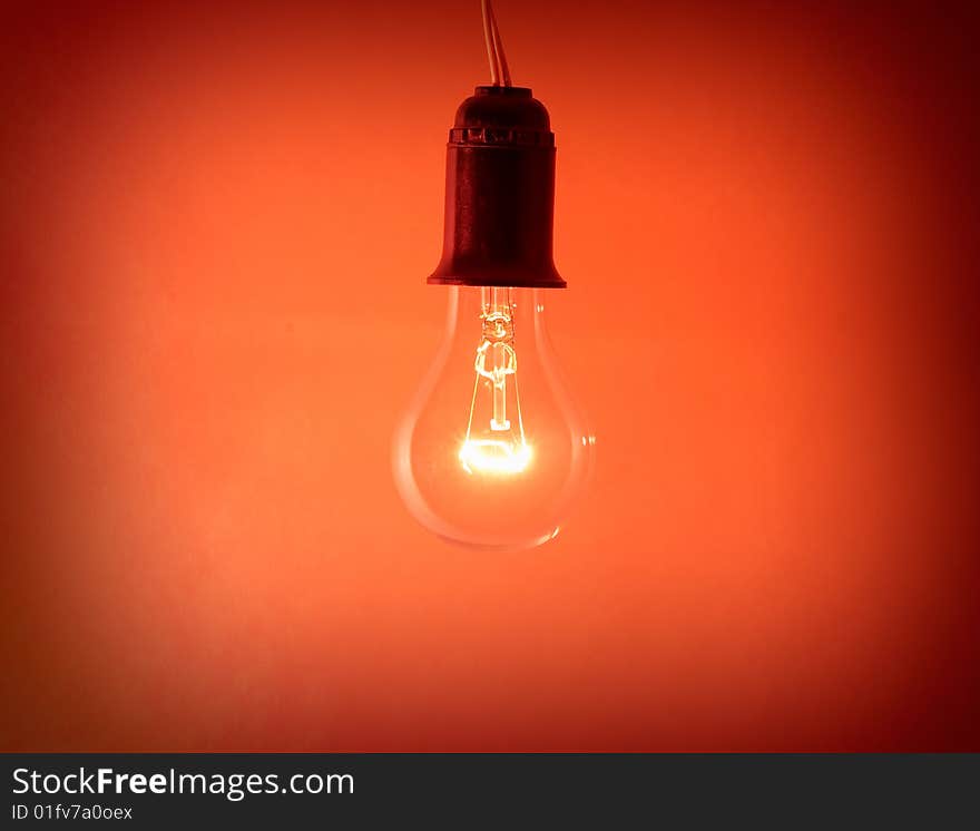 Photo of light bulb on red background