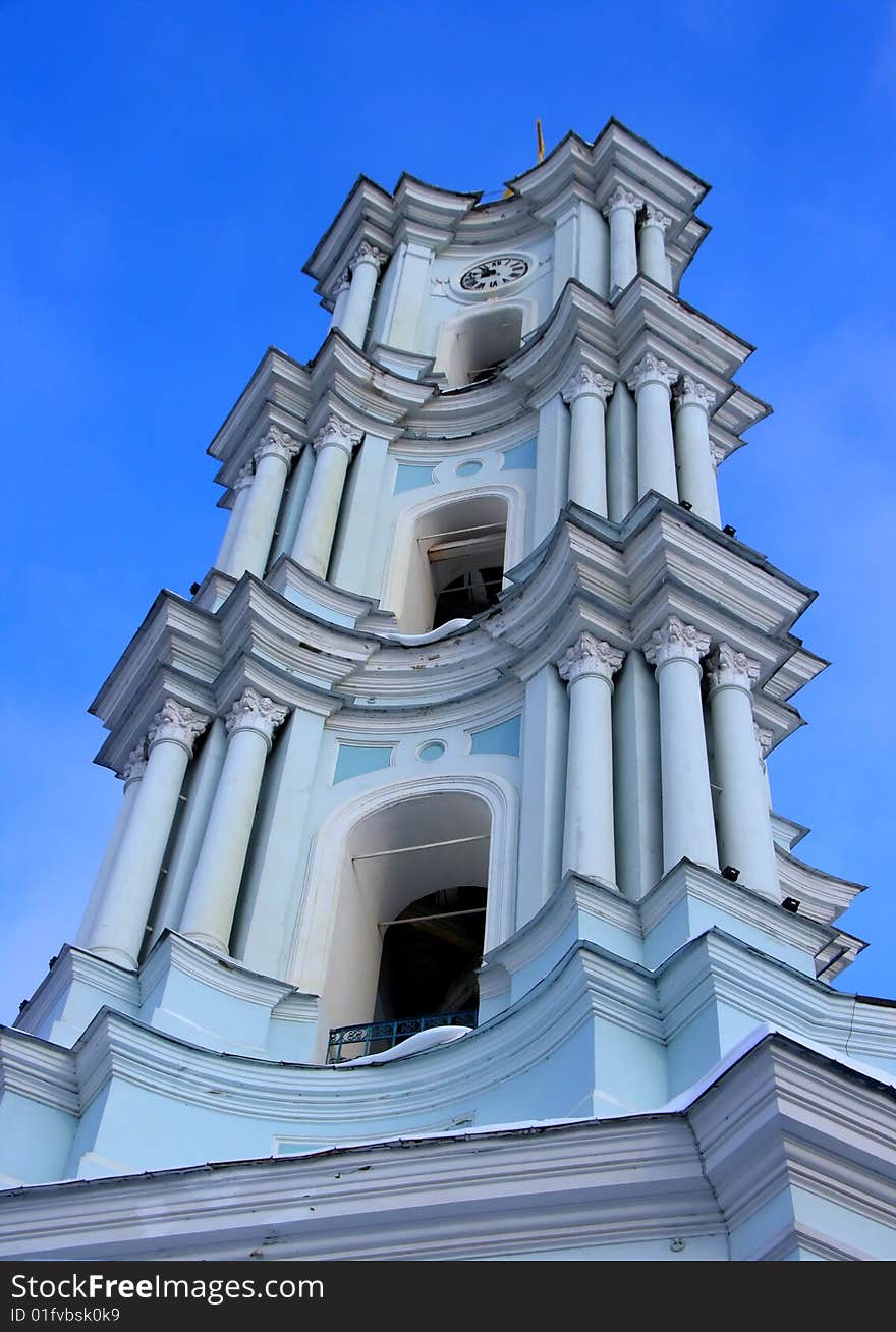 White church belfry under deep blue sky