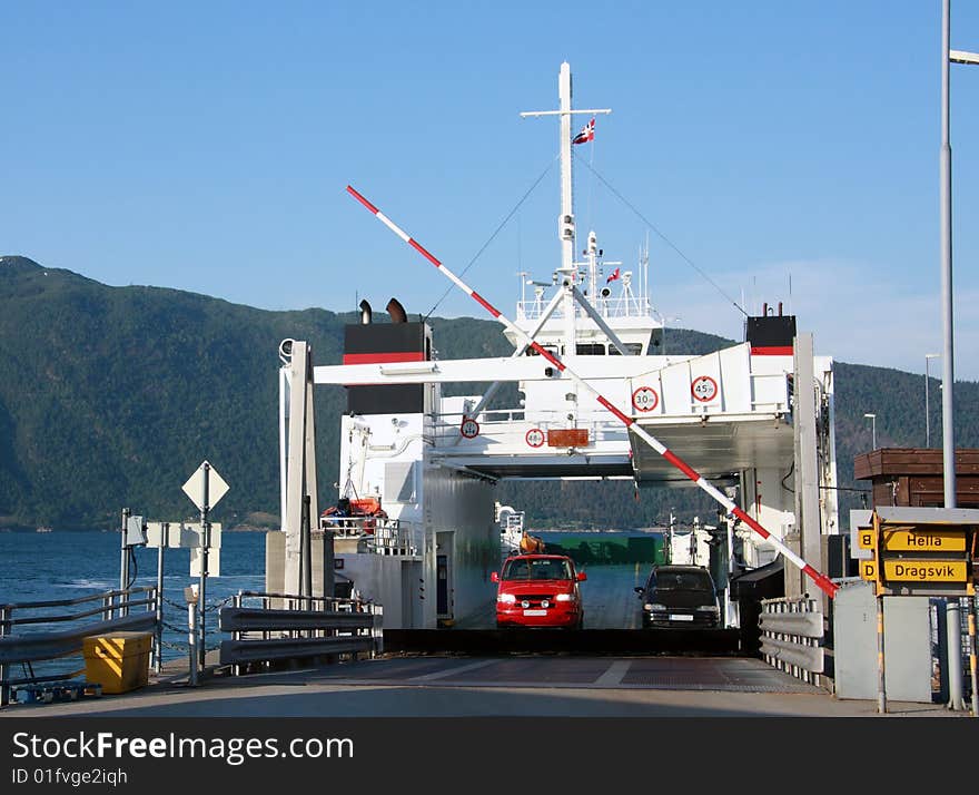 Ferry unloading cars on a fjord