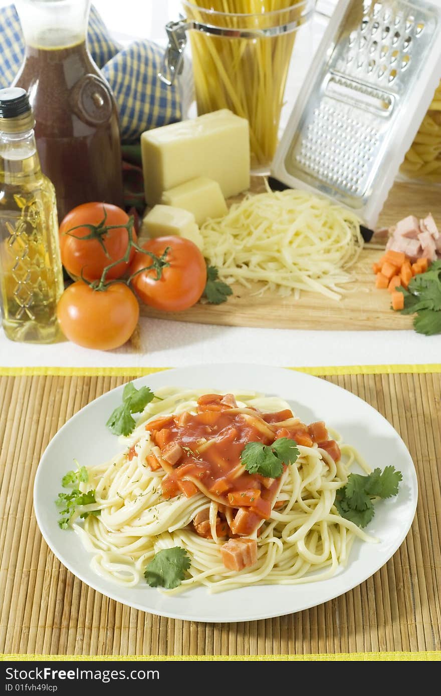 Overhead shot of freshly cooked spaghetti in a big white plate. Overhead shot of freshly cooked spaghetti in a big white plate