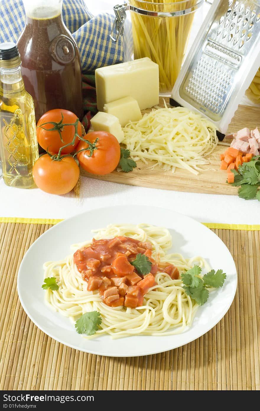 Overhead shot of a table top with spaghetti in plate. Overhead shot of a table top with spaghetti in plate