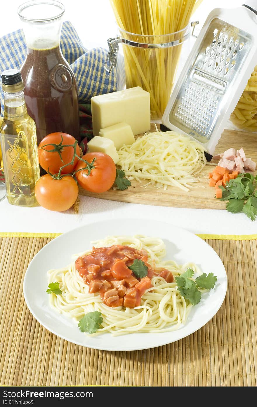 Overhead shot of freshly cooked spaghetti in a big white plate. Overhead shot of freshly cooked spaghetti in a big white plate