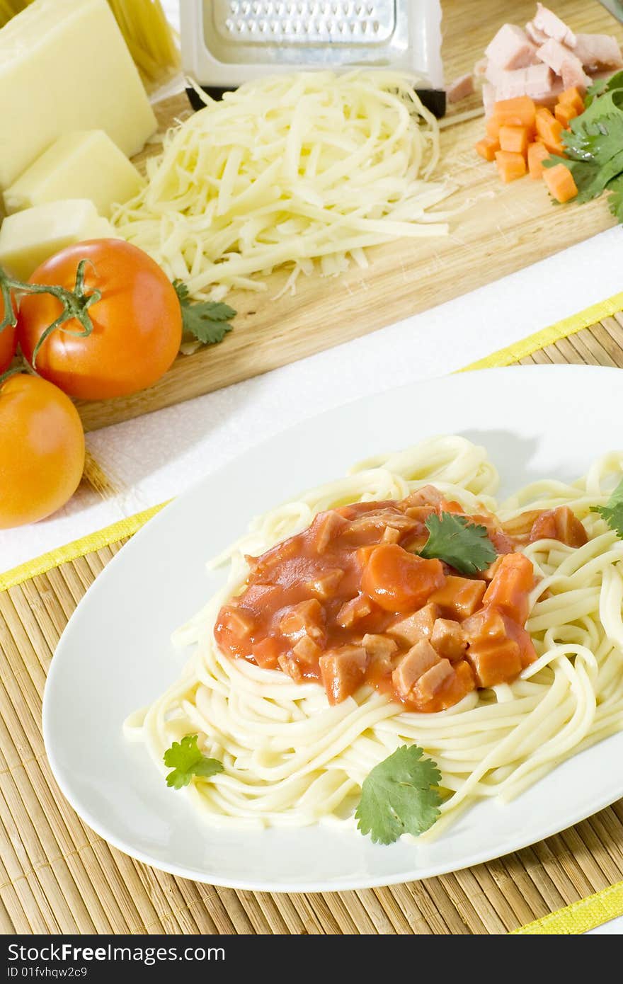 Overhead shot of freshly cooked spaghetti in a big white plate. Overhead shot of freshly cooked spaghetti in a big white plate