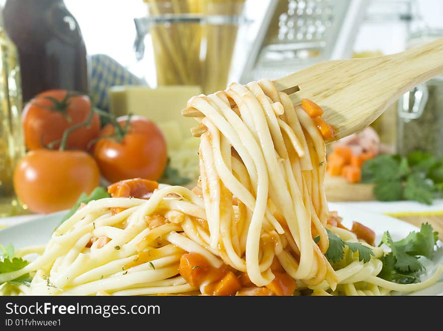 Close up shot of spaghetti on wooden fork. Close up shot of spaghetti on wooden fork