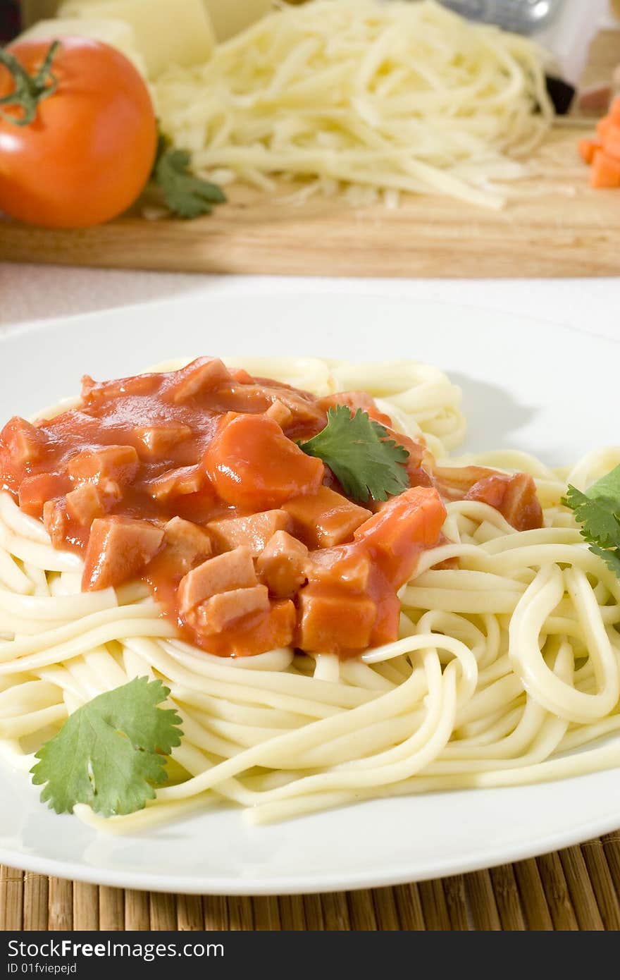 Close up shot of freshly cooked spaghetti in a big white plate. Close up shot of freshly cooked spaghetti in a big white plate