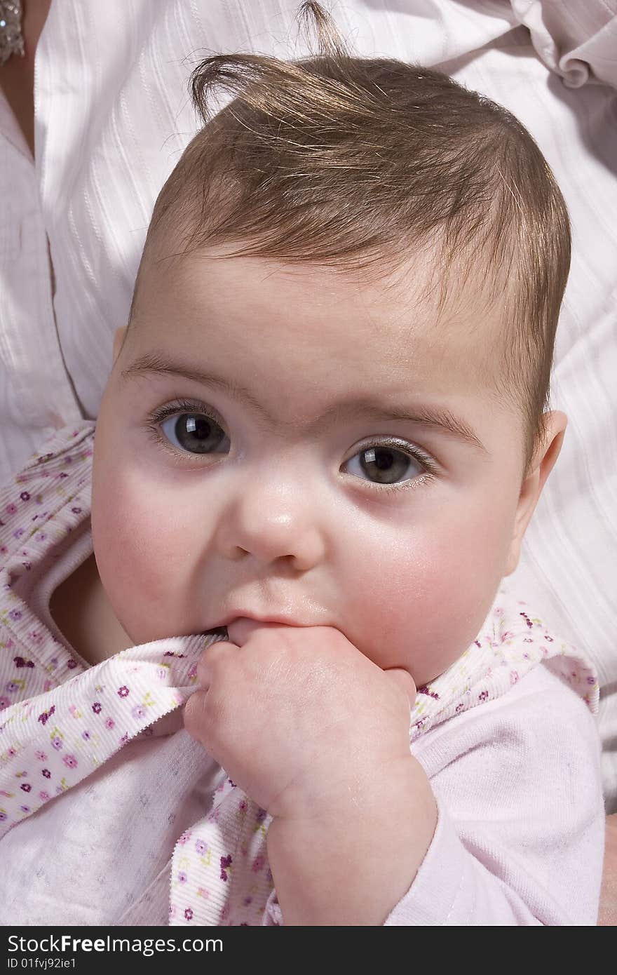 Baby eating her dress