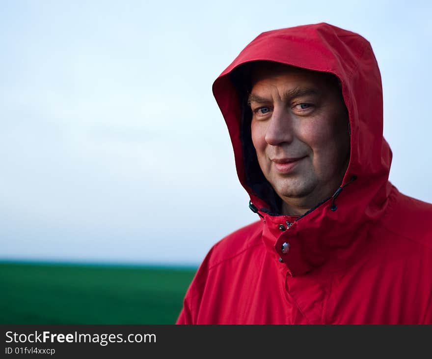 Portrait of man in red jacket outdoors. Portrait of man in red jacket outdoors